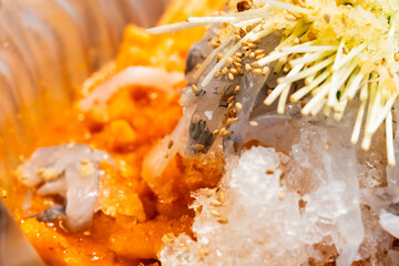 spicy cold raw fish soup called Mulhoe