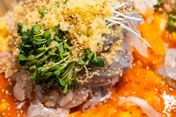 spicy cold raw fish soup called Mulhoe