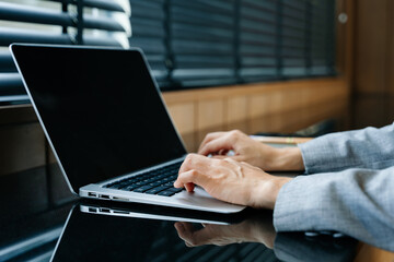 Businesswoman hand working digital marketing media in virtual screen with mobile phone and modern compute