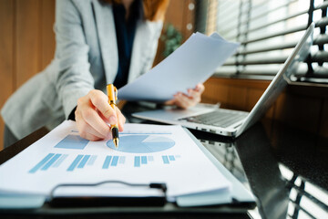 Businesswoman hand working digital marketing media in virtual screen with mobile phone and modern...