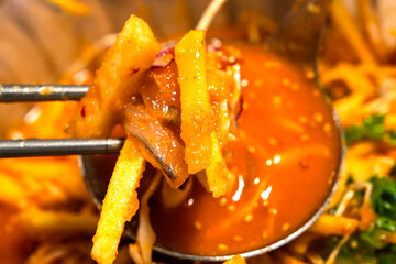 spicy cold raw fish soup called Mulhoe