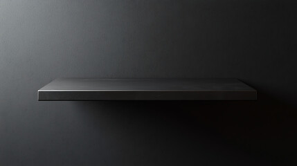 A shelf is empty and the wall behind it is black