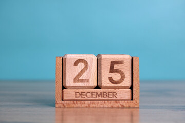 Wooden perpetual calendar showing the date of december 25th, christmas day