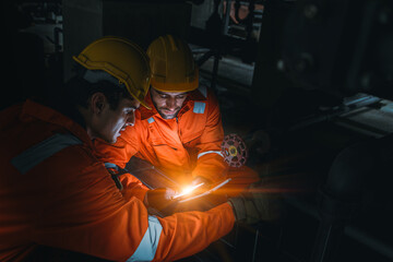 Professional Engineer team working at night shift modern technology device emergency on site service