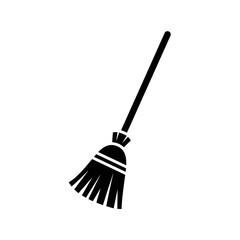 A black silhouette of a witchs broomstick, isolated on a white background