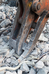 Demolition site with excavator and rubble