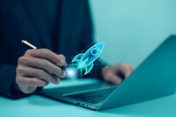  Startup business start-up with technology background as a rocket image conveying the idea of...