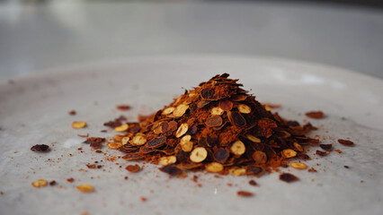 crushed dry chili flakes on surface.ai 