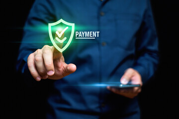 A person using a smartphone for secure payment with a digital shield and checkmarks overlayed on the screen