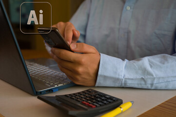 Businessman using smartphone and laptop in office. Man scrolls social media, checks email, manages...