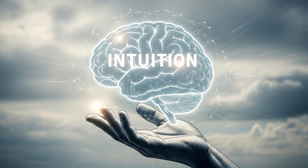 A hand holding a glowing brain with the word intuition against a cloudy sky background design element