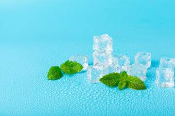 Mint and ice on texture background. Green fresh mint and ice cube. Mint leaves, ice cube and water...