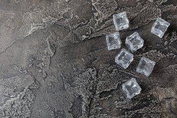 Mint and ice on texture background. Green fresh mint and ice cube. Mint leaves, ice cube and water...