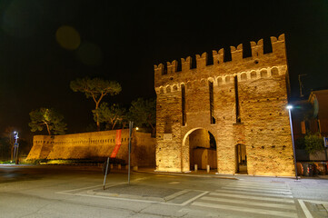 Illuminated  Double-Arched Medieval Gate – Historic Fortification in Fano, Italy
