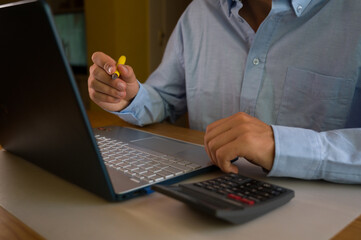 Man hands typing on computer keyboard closeup, businessman or student using laptop at office,...