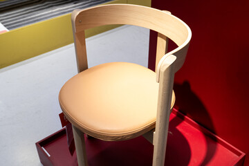Modern Wooden Chair with Leather Seat. A stylish and contemporary wooden chair featuring a comfortable light brown leather upholstered seat.