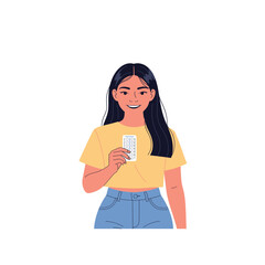 Smiling young woman holding a blister pack of pills.