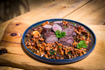 roasted chanterelles and filet from venison with fresh herbs out the garden 