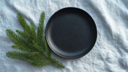 A minimalist black plate whispers autumnal equinox secrets beside evergreen fir, evoking Nordic Yule celebrations and rustic tranquility