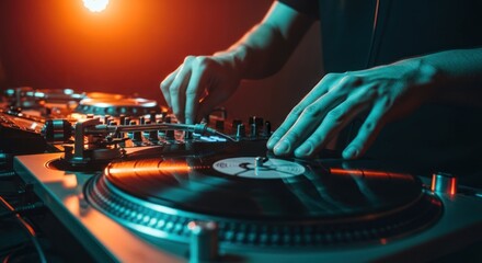 DJ hands on turntables, vibrant lighting