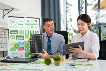 Businesspeople talk ESG strategies global warming, green finance and investment and net zero waste lifestyle.