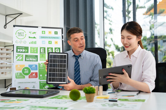 Businesspeople talk ESG strategies global warming, green finance and investment and net zero waste lifestyle.