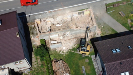 Demolition and construction work during the removal of an old building in a village. Heavy...