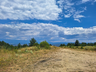 landscape with blue sky and clouds in the mountains in bulgaria