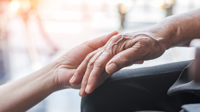 Parkinson disease elder patient, Alzheimer elderly senior, Arthritis person's hand in support of nursing family caregiver care for disability awareness day, National care givers month, aging society