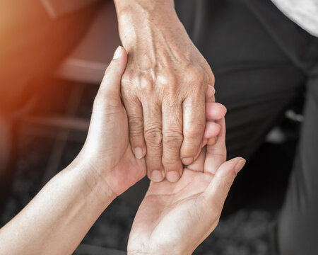 Parkinson disease elder patient, Alzheimer elderly senior, Arthritis person's hand in support of nursing family caregiver care for disability awareness day, National care givers month, aging society