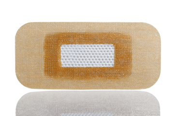Close-up of a beige adhesive bandage.