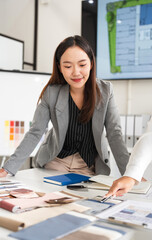 Interior design, two working colleagues designers, or decorator and client choosing finishing...