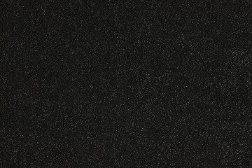 Close up of black textured plastic.
