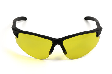 Sports and safety glasses made of black plastic. Fashionable glasses with yellow lenses.