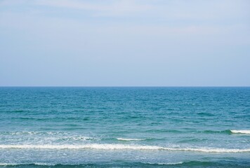 Beautiful sky and blue sea waves on the beach. only water and sky. Sea waves and sea bright