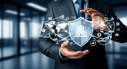 Man in suit holding a shield with building icon and world map in a digital interface overlaying hands