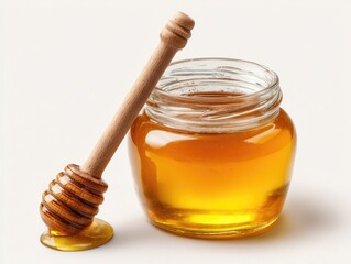Glass jar of honey with wooden honey dipper