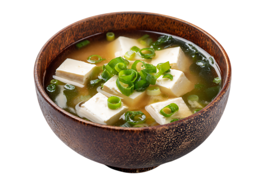 On transparent background a closeup studio shot of a steaming bowl of japanese miso soup with cubed tofu wakame