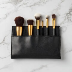 Makeup brushes in black case on marble