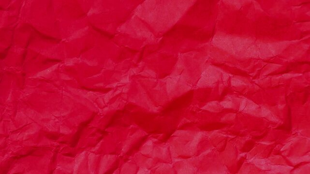 Stop motion of blank or empty red crumpled, creased, wrinkled paper page texture background, moving sheet of paper animation, design for frame