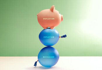 Piggy bank balances on Balloon labeled Recession, Inflation and Deflation. Global economic uncertainty and unstable financial foundations