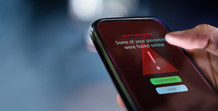 Close up smartphone display with cybersecurity alert, highlighting risks of cybercrime, data breach, and digital vulnerability. red tone