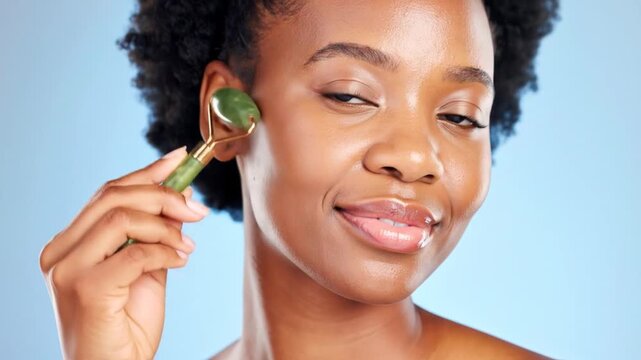 Woman using jade facial roller
