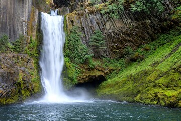 Majestic Waterfall Over Rocky Cliffs