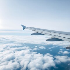 Obraz premium Airplane wing over a vast expanse of clouds.