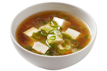On transparent background a closeup studio shot of a steaming bowl of japanese miso soup with cubed tofu wakame