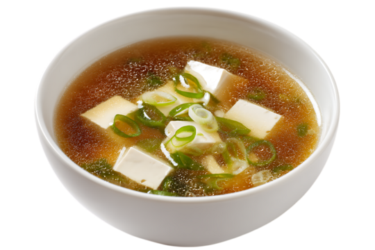 On transparent background a closeup studio shot of a steaming bowl of japanese miso soup with cubed tofu wakame