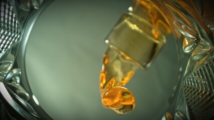 Pouring Whiskey into Glass, Macro Shot. Unique Composition Shot from Inside of the Glass.