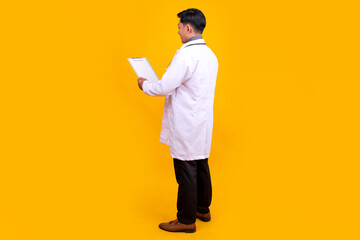 Professional Physician Focused on Reviewing Patient Information or Notes