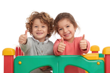 Children playing with joyful thumbs up at indoor playground. Isolated on transparent background, png.